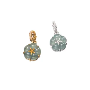Detailed view of 925 silver plated jade flower pendants in gold and silver colors