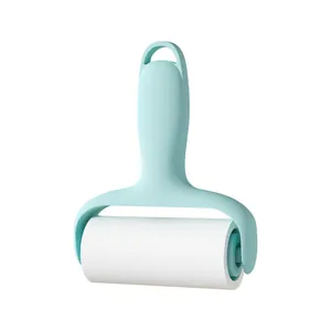 Portable mint green lint roller with replaceable adhesive paper for clothes and pet hair