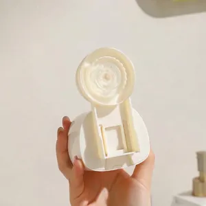 Wall-mounted suction cup mop holder for efficient bathroom and kitchen organization