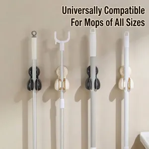 Wall-mounted mop holder clips for efficient bathroom broom storage and organization