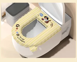 Detail view of yellow striped waterproof toilet seat cover with a cute cartoon dog motif