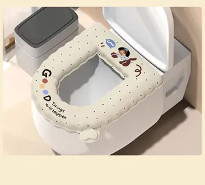 Close-up of a waterproof cartoon toilet seat cover with a cute dog design and handle