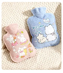 Detailed shot of two cute plush hot water bottles in pink and blue pastel colors.