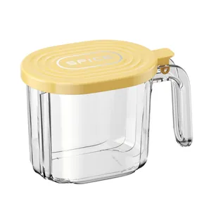 Transparent kitchen seasoning jar with a yellow sealed lid and handle for spice storage