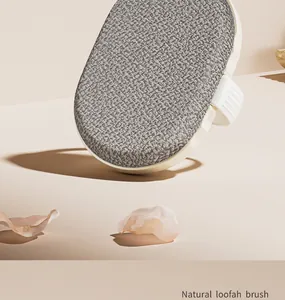 Detailed macro view of the natural loofah bath brush head with woven texture.