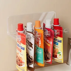 Transparent acrylic wall mounted organizer rack for hanging seasoning pouches in kitchen