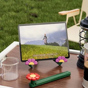 Portable foldable green tablet stand with cute flower design for outdoor camping use
