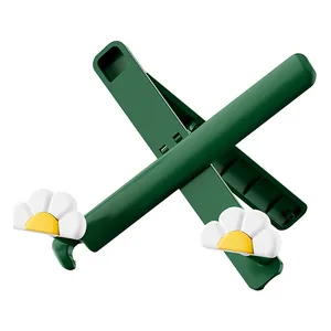 Portable foldable green tablet stand with cute daisy flower decor for stable reading support