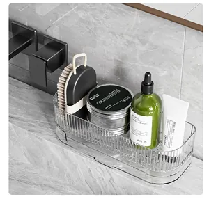 Detailed view of the clear ribbed countertop organizer in a modern bathroom setting.