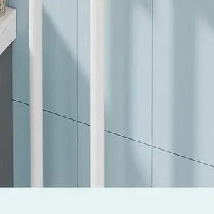 Close-up view showing the white vertical poles of a wall-mounted mop rack on blue tiles.