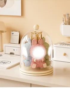 Rotating transparent acrylic display case for Labubu and blind box figures on a desk