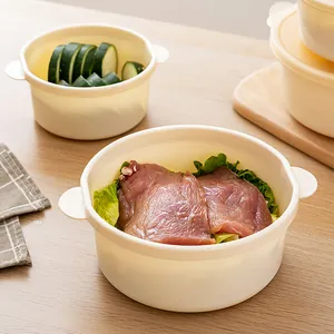 Cream-colored round food storage containers with lids and handles for kitchen use