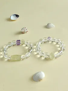 Detailansicht von Naturquarz- und Citrin-Perlenarmbändern mit geschnitztem Lotus-Anhänger