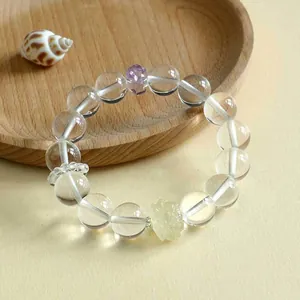 Natürliches Armband aus weißen und violetten Quarzkristallen mit elegantem Lotus-Anhänger