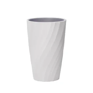 Elegant white spiral textured mouthwash cup with grey interior for modern bathroom decor