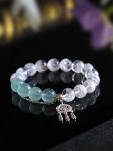 Dettaglio bracciale in argento 925 con cristallo pirotecnico e ciondolo acchiappasogni