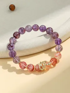 Handcrafted amethyst and pink quartz beaded bracelet with a textured gold snake charm