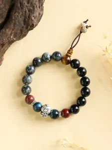 High-quality detail view of a natural stone beaded bracelet with silver snake charm and spacers