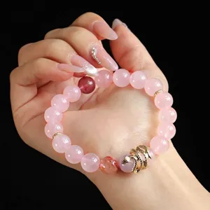 Elegant pink quartz beaded bracelet with a golden snake charm jewelry for women.