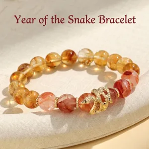 Year of the Snake beaded bracelet with golden snake charm and phantom quartz beads.