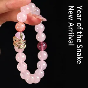 Fashionable rose quartz beaded bracelet featuring a detailed gold snake charm for women