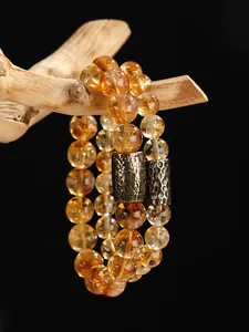 Pulsera de cuentas de citrino amarillo con piezas de metal martillado de alta calidad.