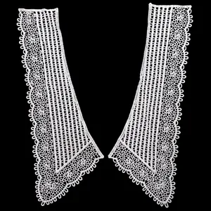 Close-up view of intricate white water-soluble hollow lace collar embroidery patches.