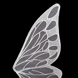 Detailed view of white butterfly wing lace embroidery patch for clothing accessories