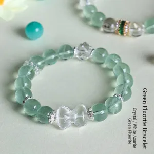 Green fluorite and white quartz beaded bracelet with a clear butterfly bow charm