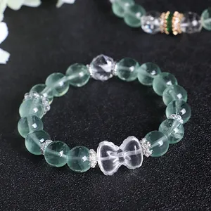 Natural green fluorite beaded bracelet with clear crystal bow and silver spacers