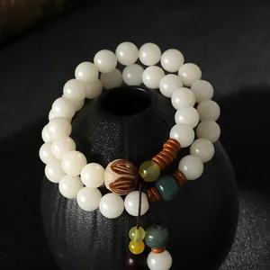 Handgefertigtes elegantes weißes Bodhi-Samen Doppelarmband mit traditionellen Lotus-Anhängern