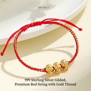 Bracciale in corda rossa intrecciata a mano con tre ciondoli a serpente in argento 999 dorato