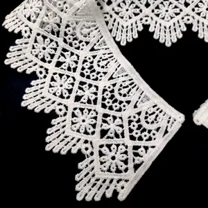 Detailed macro view of white water-soluble milk silk lace collar with floral embroidery