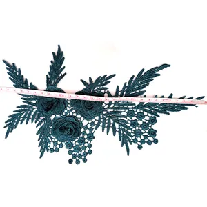 Exquisite dark green 3D floral lace applique patch measured with a white tape for DIY