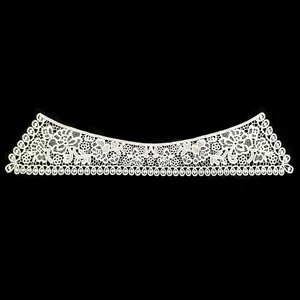Detailed view of white water-soluble lace faux collar with intricate floral embroidery patterns