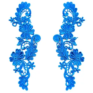 Close-up of symmetrical blue 3D water-soluble lace floral embroidery patches for DIY