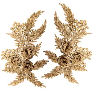Detailed texture of 3D gold floral lace appliqués for DIY clothing embellishment.