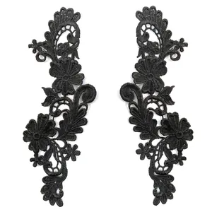 Detailed view of symmetrical black 3D water-soluble lace embroidery flower patches