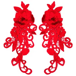 Close-up of red 3D floral lace patches with intricate water-soluble embroidery