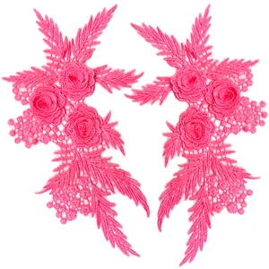 Detailed view of pink 3D floral lace appliques with intricate embroidery and hollow design.