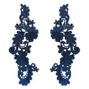 Detailed view of symmetrical navy blue lace embroidery flower patches for DIY clothing