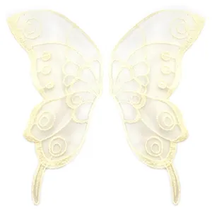 Macro view of beige lace mesh embroidered butterfly patches for DIY sewing accessories