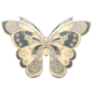 Macro view of intricate butterfly embroidered patch collar featuring gold thread and grey lace.