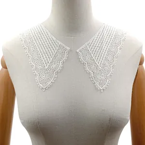 Close-up of white water-soluble lace detachable collar on a female mannequin torso