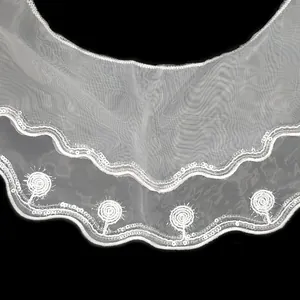 Detailed view of white double-layer organza doll collar with delicate sequin embroidery