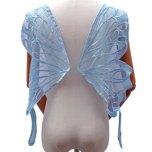 Macro view of blue butterfly lace embroidery applique for swimwear and dress back decor