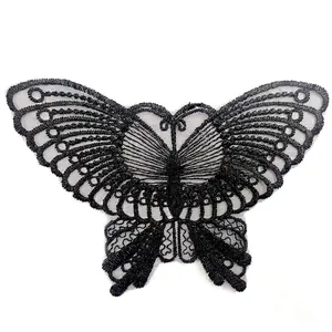 Detailed view of a black embroidered butterfly lace patch with intricate organza patterns.