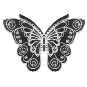Detail showing intricate black and white butterfly water-soluble lace embroidery
