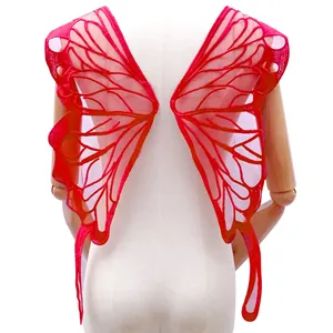 Detailed back view of a large red lace butterfly wing embroidery appliqué on white mannequin