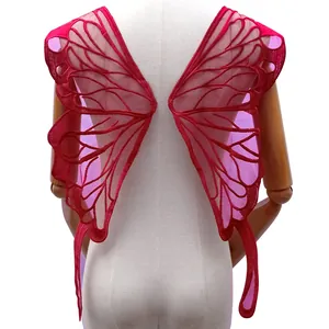 Detail view of large red butterfly wing lace embroidery patch for lingerie back decoration
